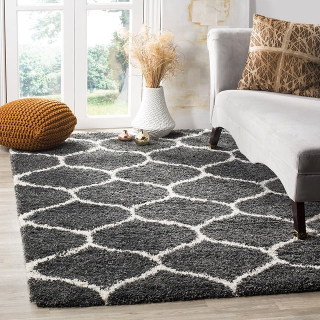 Safavieh Hudson Arline gray shag area rug featuring a white geometric trellis pattern in a modern living room setting