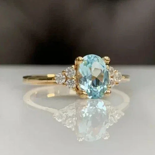 Women's Lab-Created Aquamarine 3Ct Oval Cut Solitaire Ring in 14K Yellow Gold Plated