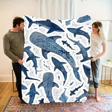 A Soft And Cozy Fleece Blanket Featuring a Marine Blue Whale Shark Theme, Perfect for Home Use.
