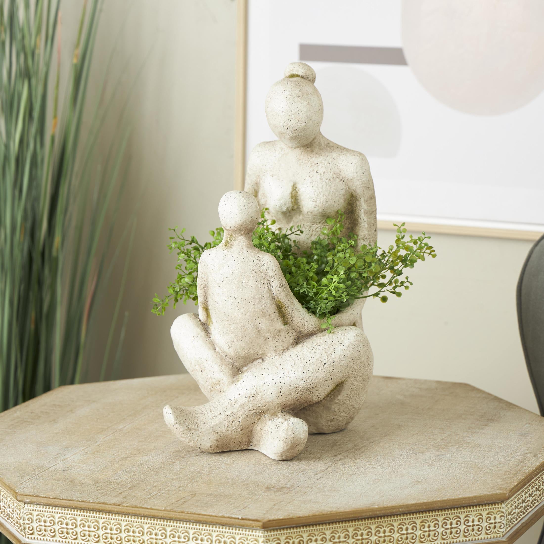 DecMode 12" x 17" Sitting Cream Polystone Family Planter