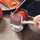 thumbnail image 3 of Cortador de tomates y limones de acero inoxidable, soporte para cortar frutas y verduras de piel suave, comida casera, 3 of 5