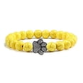 thumbnail image 1 of Pulsera con dije de huella de pata de piedra volcánica de lava negra mate natural, ideal como recuerdo para mascotas, amantes de los gatos y los perros., 1 of 2