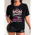thumbnail image 1 of Camiseta informal de mujer negra con estampado floral y letras, cuello redondo, manga corta, algodón (lavable a máquina), romántica, estampado de lazo, top deportivo de ocio., 1 of 7