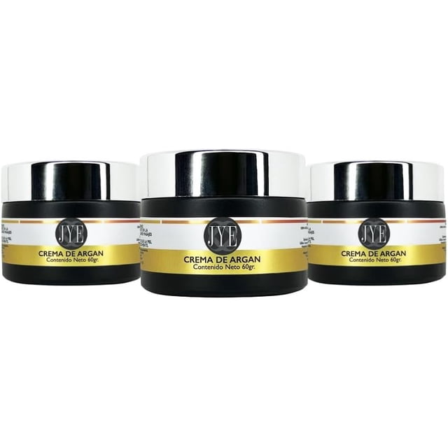 3 tarros de crema de argan altamente hidratante y de absorción inmediata; vista frontal de tres frascos negros con tapa plateada y etiqueta amarilla que dice "Crema de Argan", 60 g por frasco, ideal para todo tipo de piel y a menudo usada también para manos y codos secos.