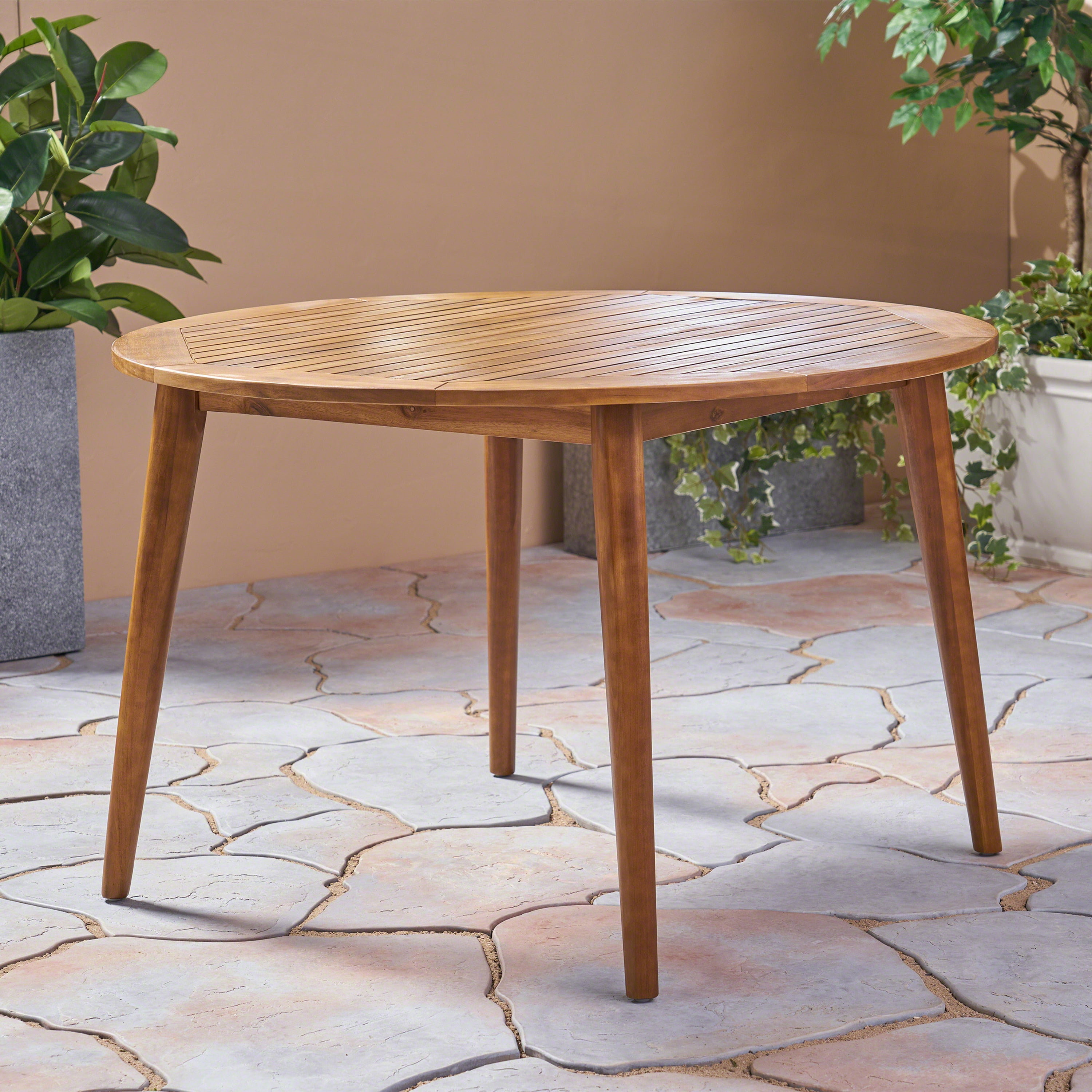 Euroco simple and sleek acacia wood dining table is the perfect addition to any backyard space