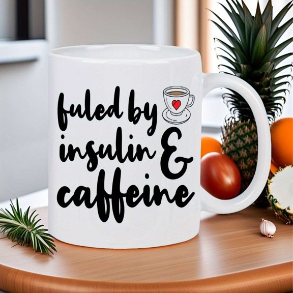 11oz white ceramic mug with "Fueled by Caffeine" design. Insulated and reusable, keeps hot drinks warm for longer. Food-safe diabetic-friendly construction, hand wash only. Suitable for home, office
