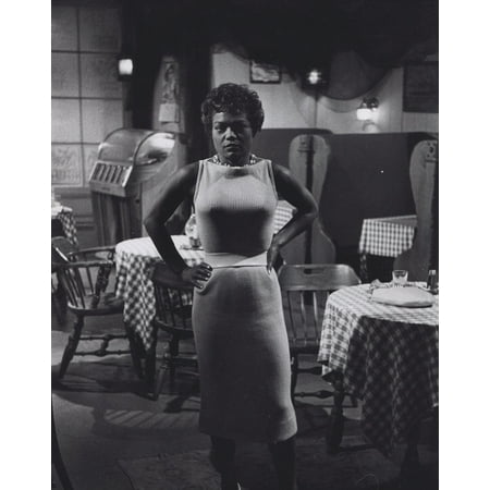 Photo Dining Room - Eartha Kitt standing in an empty dining room Photo Print