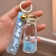 thumbnail image 1 of Llavero personalizado personalizado de Hello Kitty, botella de leche acrílica, líquido que fluye, llavero de arena movediza, colgante de líquido móvil, 1 of 4