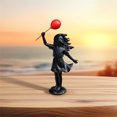 thumbnail image 4 of La estatua de resina de la niña con globos negros, con su elegante diseño, es el complemento perfecto para cualquier estancia, desde el salón hasta el dormitorio., 4 of 7