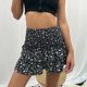 thumbnail image 1 of Falda Corta De Verano Para Mujer Bolsa Falda a la cadera Estampado floral Plisado Cintura alta Vacaciones Vacaciones (Negro S) Cgtredaw Para estrenar, 1 of 1