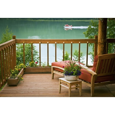View Of The Deck And Chair With Floatplane Landing On Big River Lake In The Background At Redoubt Bay Lodge In The Redoubt Bay State Critical Habitat Area Southcentral Alaska Canvas Art - Jeff