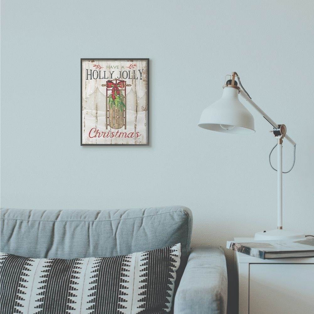 Stupell Industries Holly Jolly Christmas Sleigh Wood Texture Holiday Word DesignFramed Wall Art By Artist Jennifer Pugh