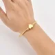 thumbnail image 2 of Brazalete Pulsera Ryscom Forma de Espiral con Dije de Corazon Color Dorado Acero Inoxidable, 2 of 5