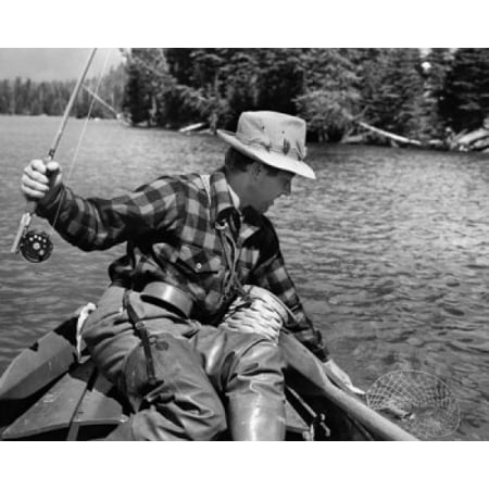 Close-up of a young man fishing for trout in a lake Yellowstone Lake Yellowstone National Park Wyoming USA Stretched Canvas -  (18 x