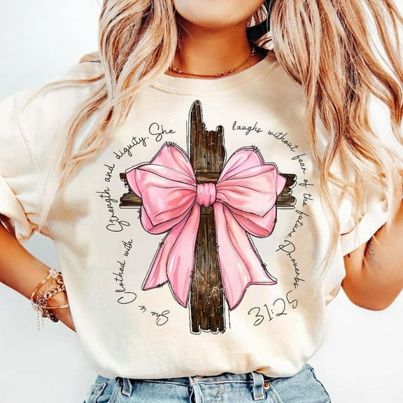 She Is Clothed with Strength T-Shirt, Light Pink Coquette Bow Tee, Bible Verse Christian Shirt, Preppy Faith-Based Graphic T-Shirt