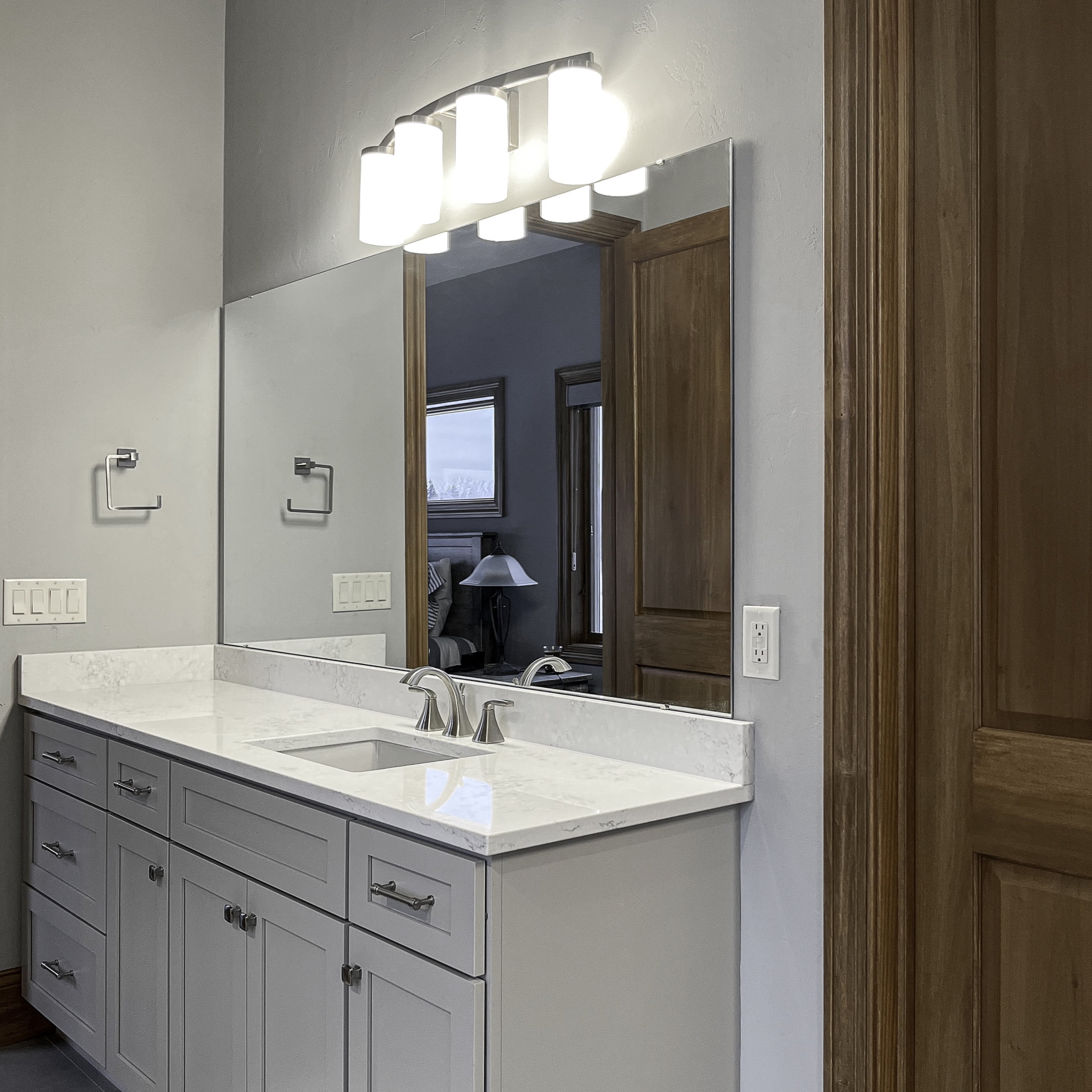 Desta 30" Satin Nickel 4-Light Dimmable Vanity Light With Curved Bar Design and Frosted Glass