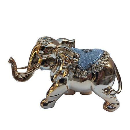 

Delightfully extravagant gold plated elephant with inlaid stone mount (12 L x 6 W x 7.5 H) by Ambrose