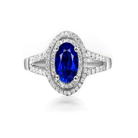 1.50 Carat oval cut Blue Sapphire and Diamond Halo Engagement Ring in White Gold