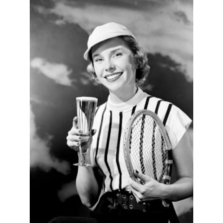Portrait of smiling woman holding champagne and tennis racket Stretched Canvas -  (18 x