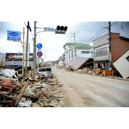LAMINATED POSTER Debris, rubble and damaged vehicles line the streets for several blocks in the coastal fishing town Poster Print 24 x