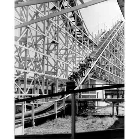 Low angle view of a group of people riding on a roller coaster Coney Island Brooklyn New York City USA Poster