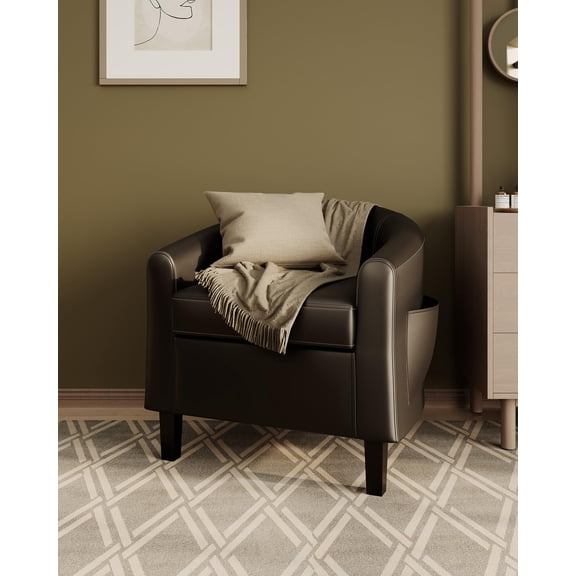 Black Faux Leather Barrel Club Armchair with Side Pocket and Fringed Throw