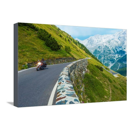 Alpine Road Biker. Motorcycle on the Stelvio Pass, Italy, Europe. Scenic Italian Mountains Road. Stretched Canvas Print Wall Art By