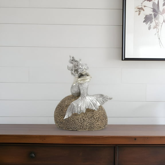 Contemplative Mermaid on a Rock Sculpture