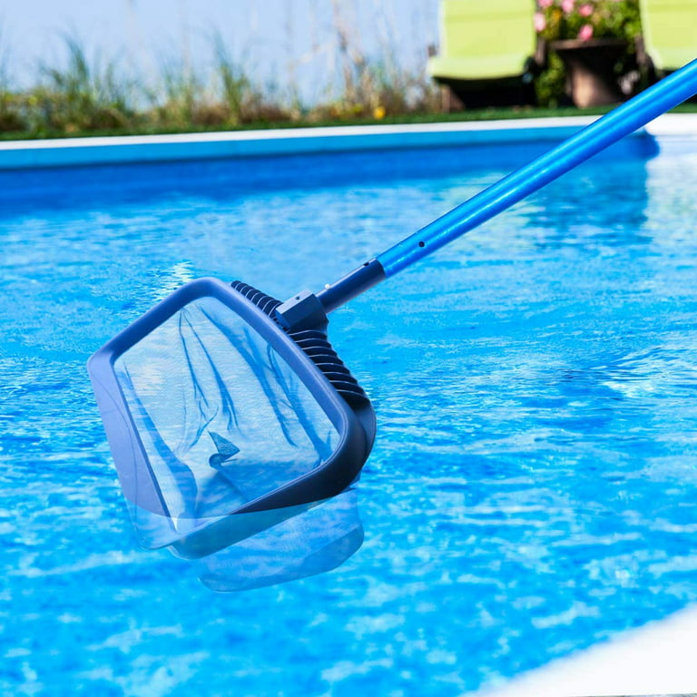 Maintenance man using a pool net leaf skimmer rake in summer to