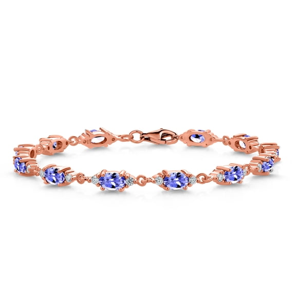 Gem Stone King 18K Rose Gold Plated Silver Blue Tanzanite and White Moissanite Tennis Bracelet for Women (6.31 Cttw, Gemstone Birthstone, Oval 6X4MM, 7 inch)