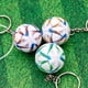thumbnail image 2 of Llavero con colgante de bolsa esférica con diseño de la Copa del Mundo de fútbol de Qatar, 2 of 6