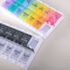thumbnail image 5 of Caja de medicamentos con clasificación de rebote tipo empuje, caja de medicamentos portátil, caja de almacenamiento de medicamentos de viaje de 14 rejillas para la mañana y la tarde durante una semana, 5 of 5