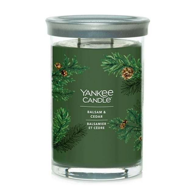 Yankee Candle Signature Large Tumbler scented candle with balsam and cedar fragrance, decorated with pine branch illustrations on a green background.