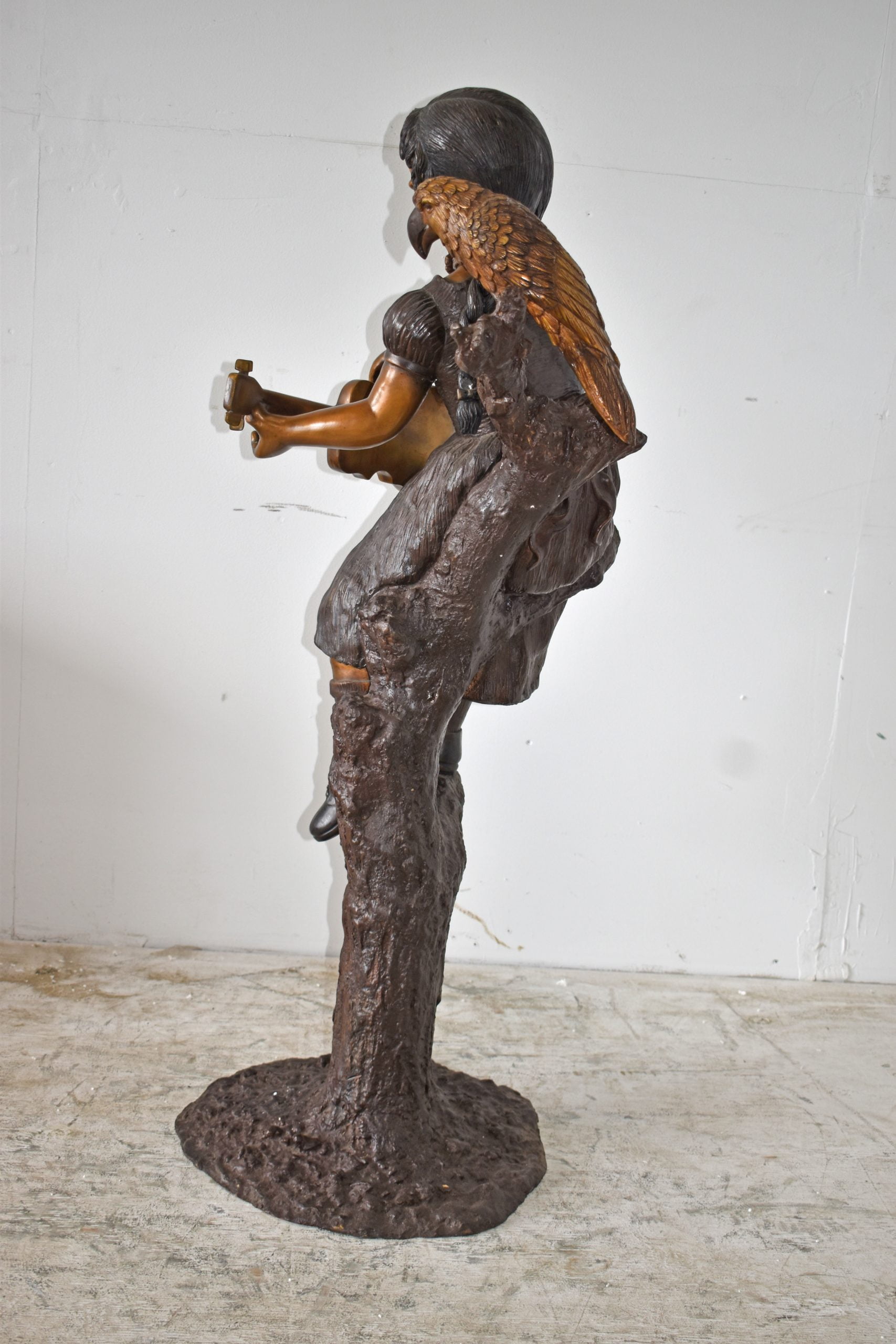 Nifao Girl on a Tree Playing the Ukulele with a Parrot Bronze Statue – Garden Outdoor Decor Sculpture, 25"L x 23"W x 50"H