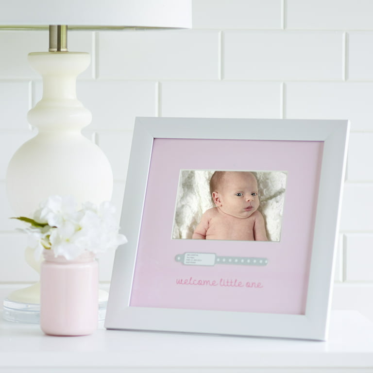 Newborn baby being weighed in a hospital available as Framed Prints,  Photos, Wall Art and Photo Gifts