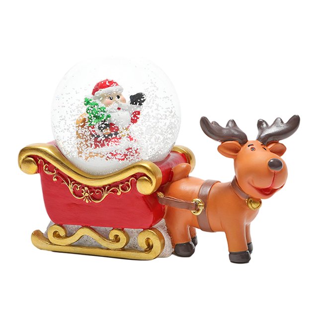 Bola de nieve navideña con figuras de adornos navideños para decorar la sala de estudio. Alce