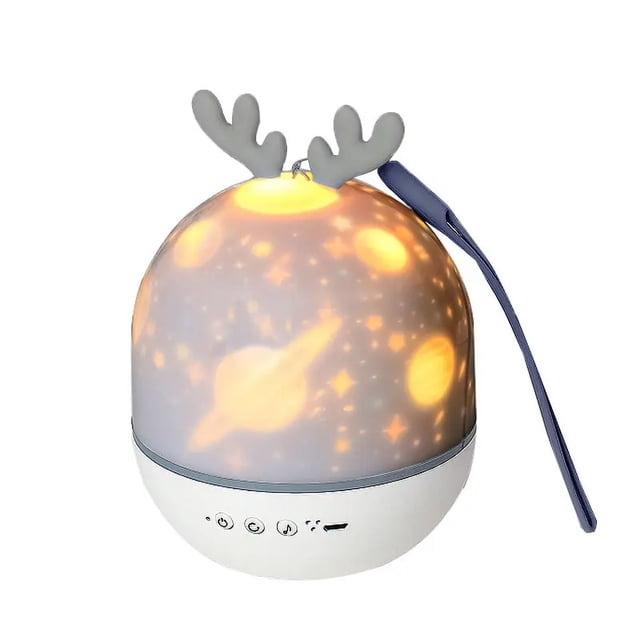 ocean wave star proyector luz nocturna reproductor de música incorporado lámpara de noche para bebé lámpara de noche para dormir lámpara de mesa cúpula blanca con base redonda, proyección de olas, planetas y estrellas en luz ámbar, botones frontales y puerto de carga visibles, adorno superior tipo astas grises y correa lateral azul; suele usarse también como luz ambiental para dormir.