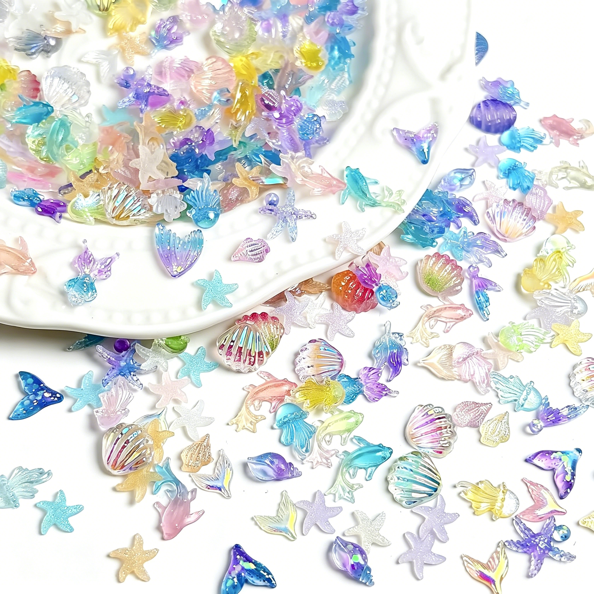 RAGUPEL 200Pcs Ocean Nail Charms 3D Resin Starfish Jellyfish Nail Rhinestones Marine Life Seashell Charms for Acrylic Nail Art Sea Nail Gems Summer Beach Nail Jewelry Nail Supplies for Women