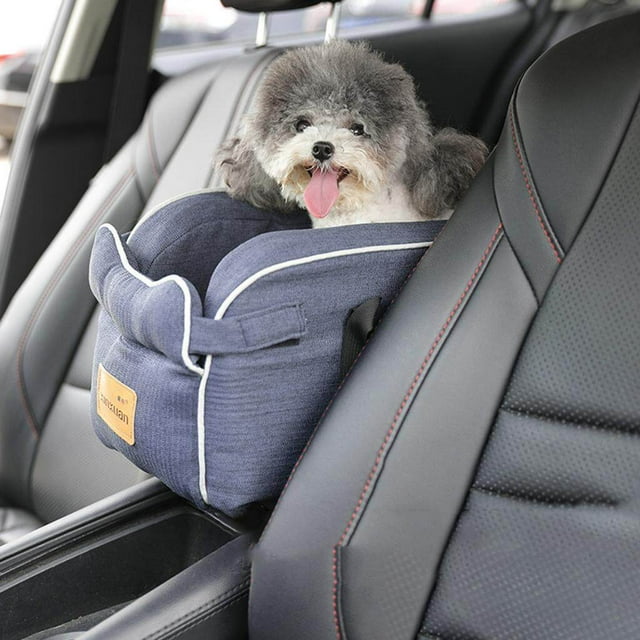 Pet Dog Cat Puppy Booster Car Seat Small Dog Small Dog Cat Car car booster seat Console Secure Safety Travel Seat Blue. A compact pet car seat in blue fabric with white piping, designed for small dogs or cats under 12kg. The seat is securely placed on a car console, featuring elastic straps for stability and an open top for breathability. A small dog is comfortably seated inside, showcasing its suitability for travel. Made of a durable sponge, cotton, and linen blend, measuring 49x25x21cm.