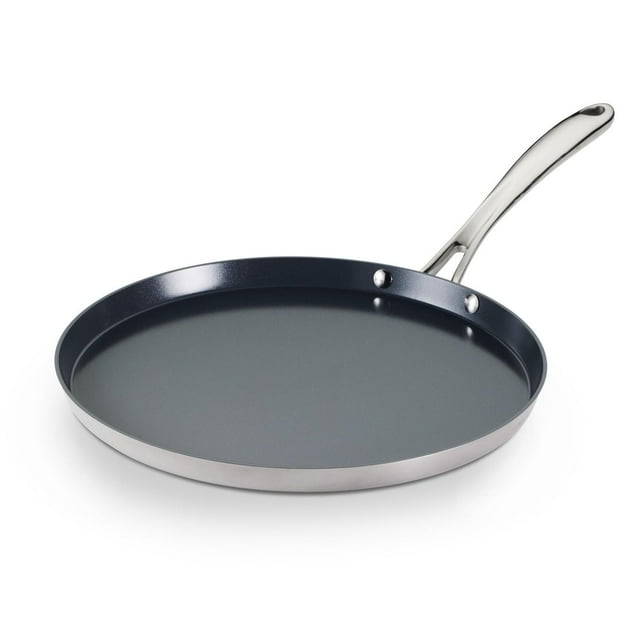 Tramontina Utsava tri-ply clad stainless steel dosa tawa featuring a ceramic nonstick cooking surface and ergonomic long handle for easy flipping.