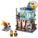 thumbnail image 4 of LEGO 31105 Creator 3-en-1 Adosada Juguetería - Pastelería - Set de construcción de floristerías, con flores y un paseo en cohete para niños de 8+ años, 4 of 8