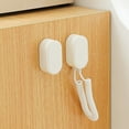 thumbnail image 4 of Wall Mounted Remote Control Holder with Retractable Cord for TV and Air Conditioner No Drilling Installation and Wall Damage Free Storage Organization Solution, 4 of 6