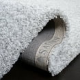 thumbnail image 4 of SAFAVIEH Ultimate Atanas Solid Plush Polyester Shag Area Rug, Silver/Ivory, 5' x 8', 4 of 6