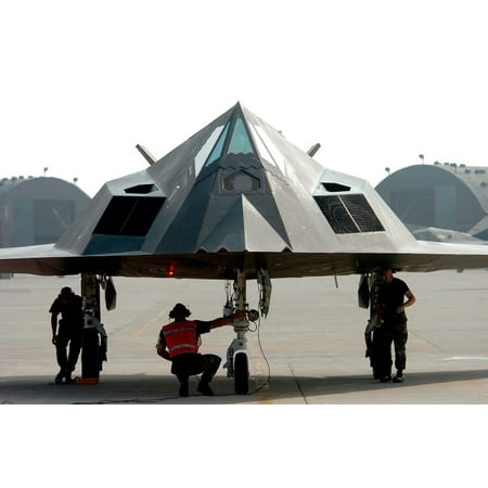Airmen conduct an end of runway check on an F-117 Nighthawk fighter Poster Print by Stocktrek Images