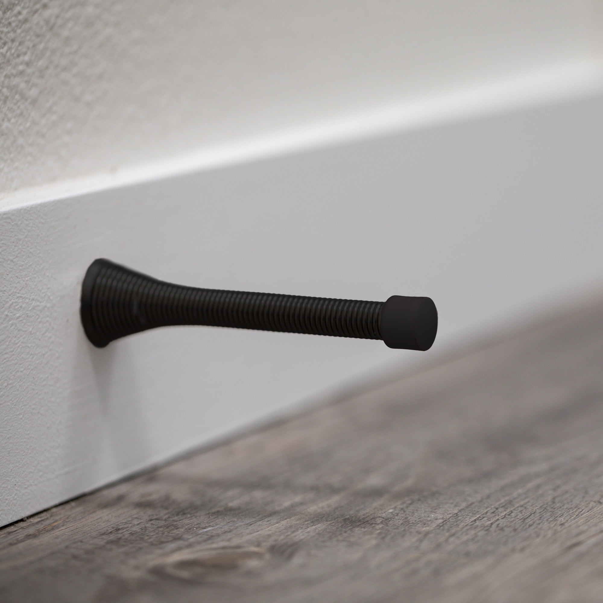 Design House 10-Pack Spring Door Stops with Rubber Tips, Matte Black