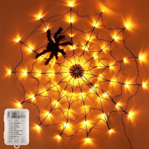 Telaraña de 60 LED, 3,25 pies de diámetro, ilumina la telaraña, decoración de Halloween, juguete de araña de peluche negro, luz naranja impermeable a batería para decoración de paredes en interiores y