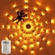 thumbnail image 1 of Telaraña de 60 LED, 3,25 pies de diámetro, ilumina la telaraña, decoración de Halloween, juguete de araña de peluche negro, luz naranja impermeable a batería para decoración de paredes en interiores y, 1 of 5