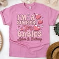 thumbnail image 1 of Women’s Graphic Tee with Heart Lollipop Design for Maternity Nurses, Azalea, Size M, 1 of 6