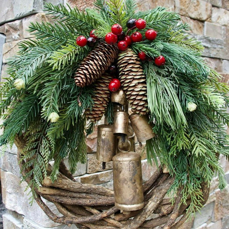 Welcome this winter season with this classic pine cone door swag