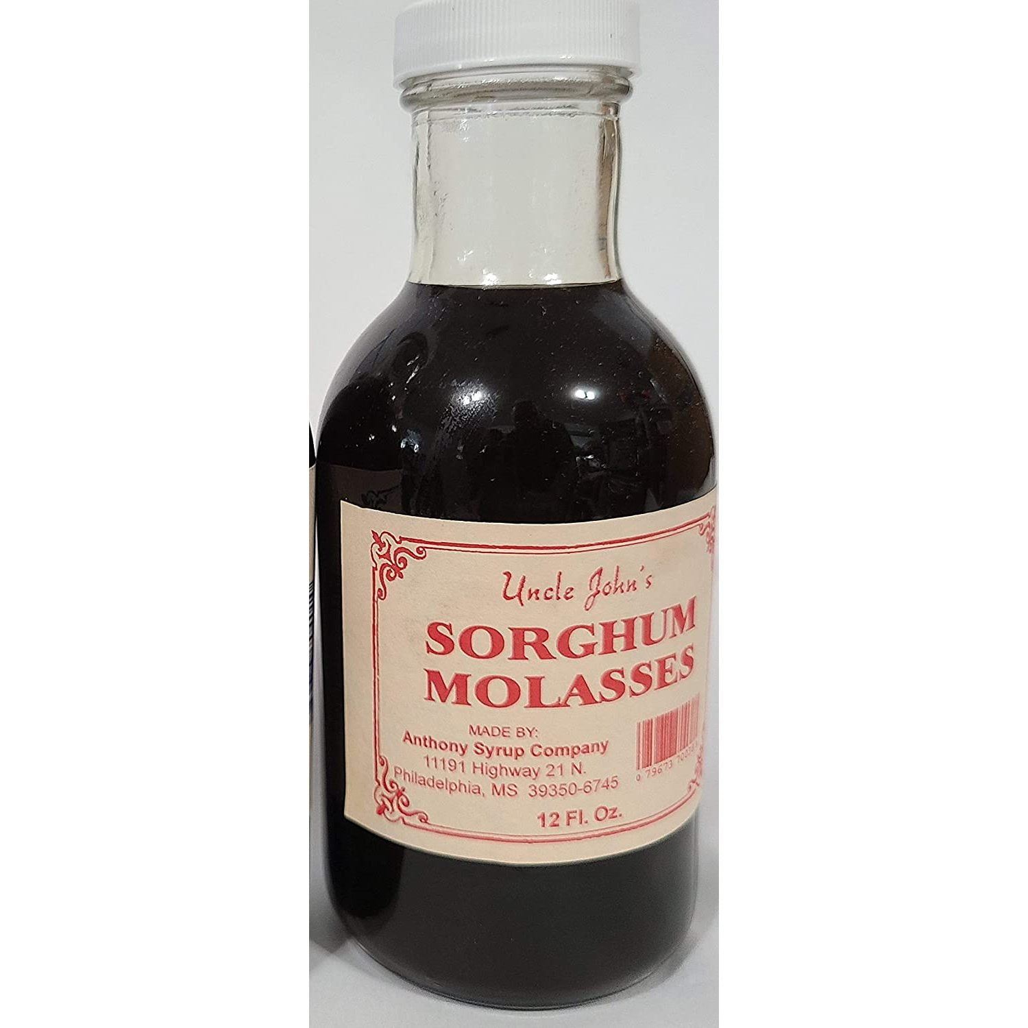 Natural Syrup Made in Miss. Molasses in a 12 Fluid Oz Glass